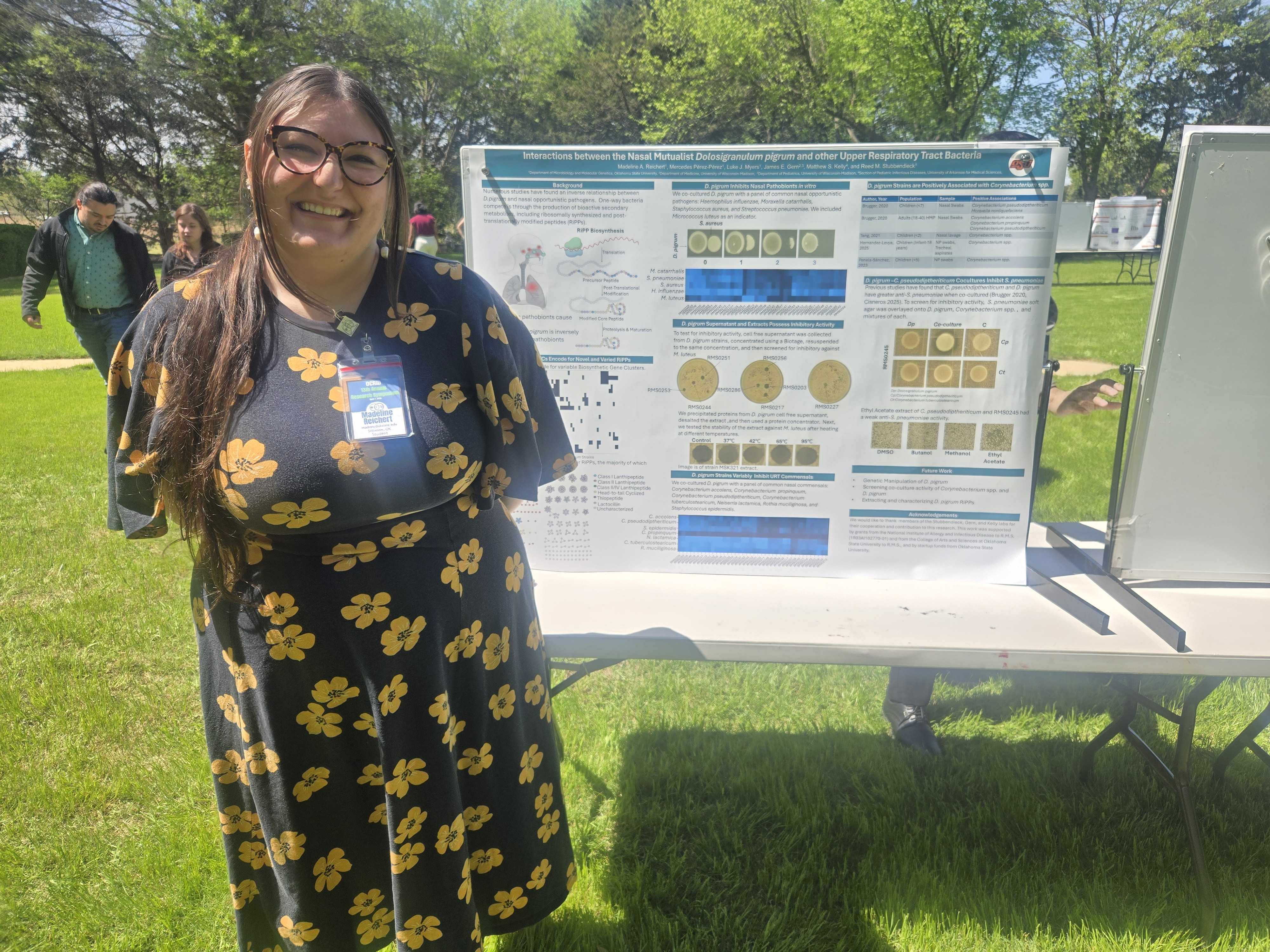 Madeline presenting her poster at the OCRID symposium.