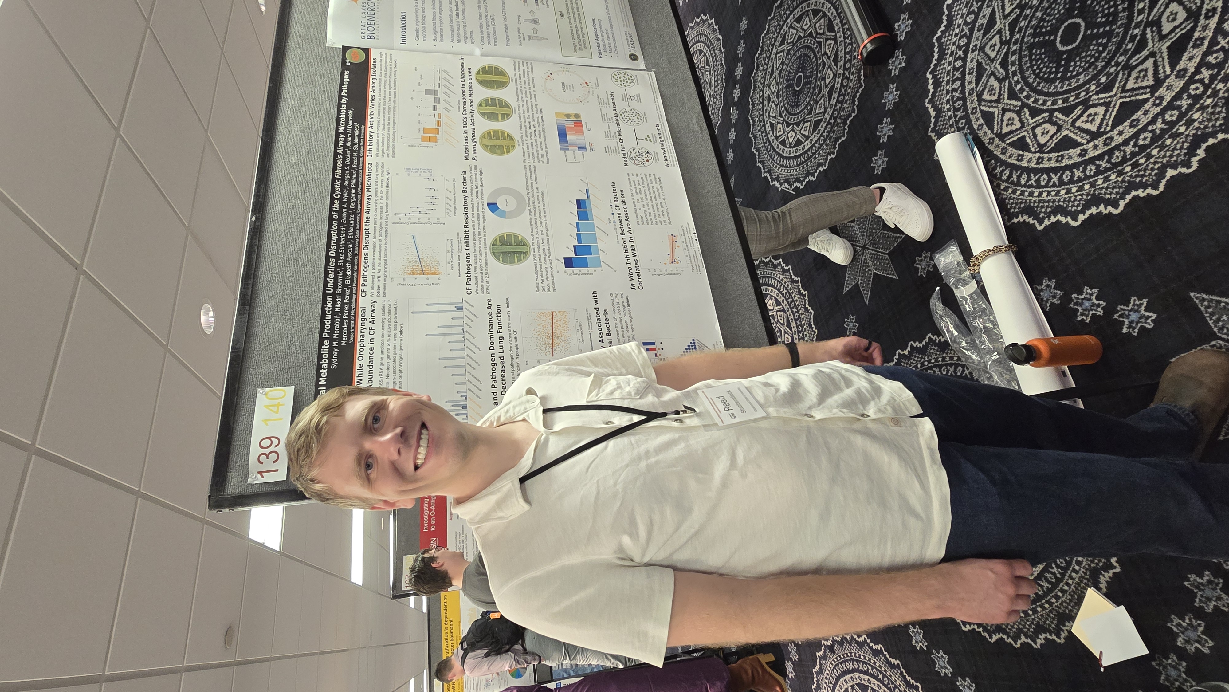 Reed presenting his poster at the Midwest Microbial Pathogenesis Conference.